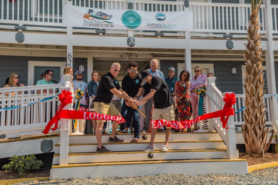 Loggerhead Inn and Suites celebrates a grand reopening in 2021 with town officials in Surf City. It's one of many boutique inns on Topsail Island in Pender County. COURTESY PHOTO