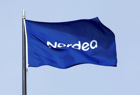 FILE PHOTO: A flag flutters over the Nordea bank headquarters in Helsinki