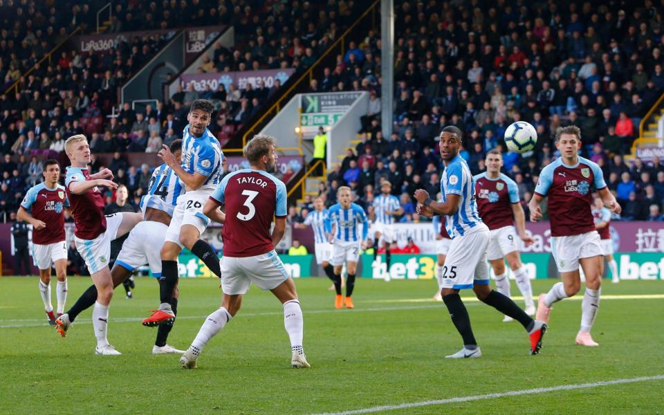 Christopher Schindler watches as his header goes in to equaliser for Huddersfield Town - Action Plus