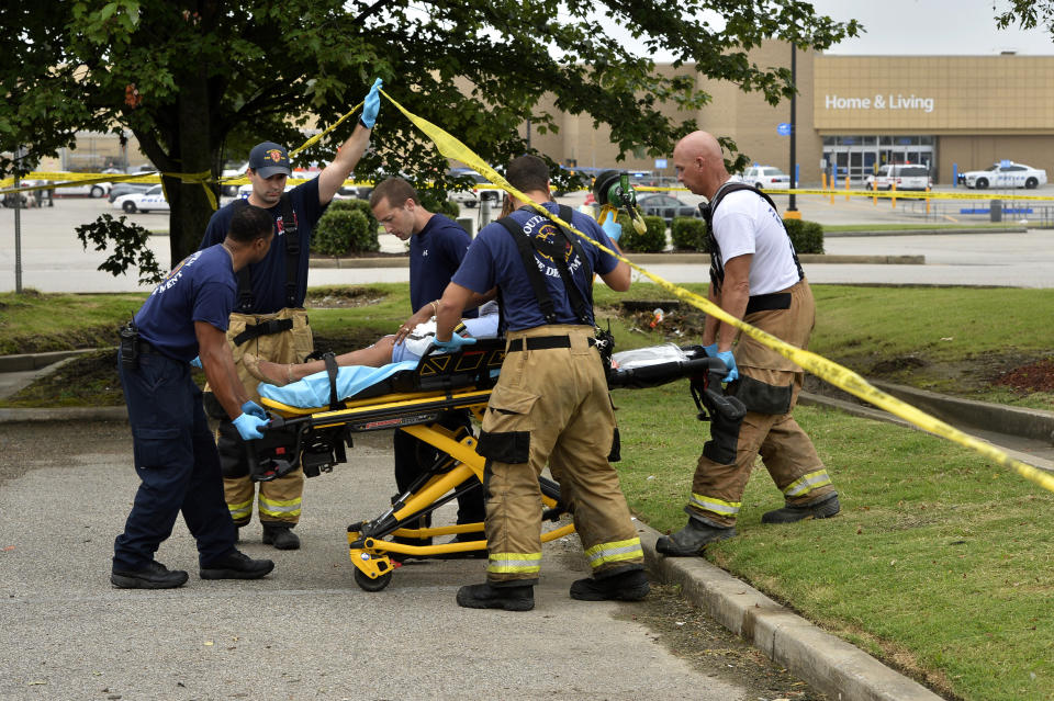 Paramedics offer medical attention after a shooting at a Walmart store Tuesday, July 30, 2019 in Southaven, Miss. (Photo: Brandon Dill/AP)