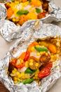 <p>Wrap up chicken and summer veggies for a fast and super-fresh meal.</p><p>Get the recipe from <a href="/cooking/recipe-ideas/recipes/a47496/chicken-tomatoes-and-corn-foil-pack-recipe/" data-ylk="slk:Delish;elm:context_link;itc:0;sec:content-canvas" class="link ">Delish</a>.</p>