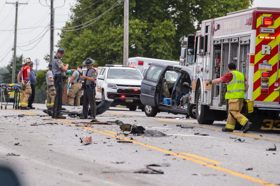 A large debris field is seen at the scene where a man was heavily entrapped inside a minivan after a crash on Route 30, Friday, Aug. 2, 2024, in Berwick Township.