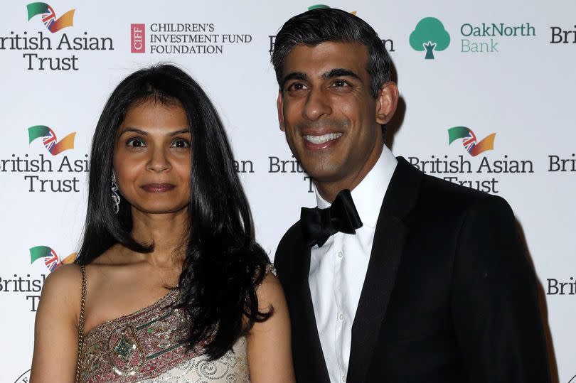 Rishi Sunak poses with his wife Akshata Murthy -Credit:Getty