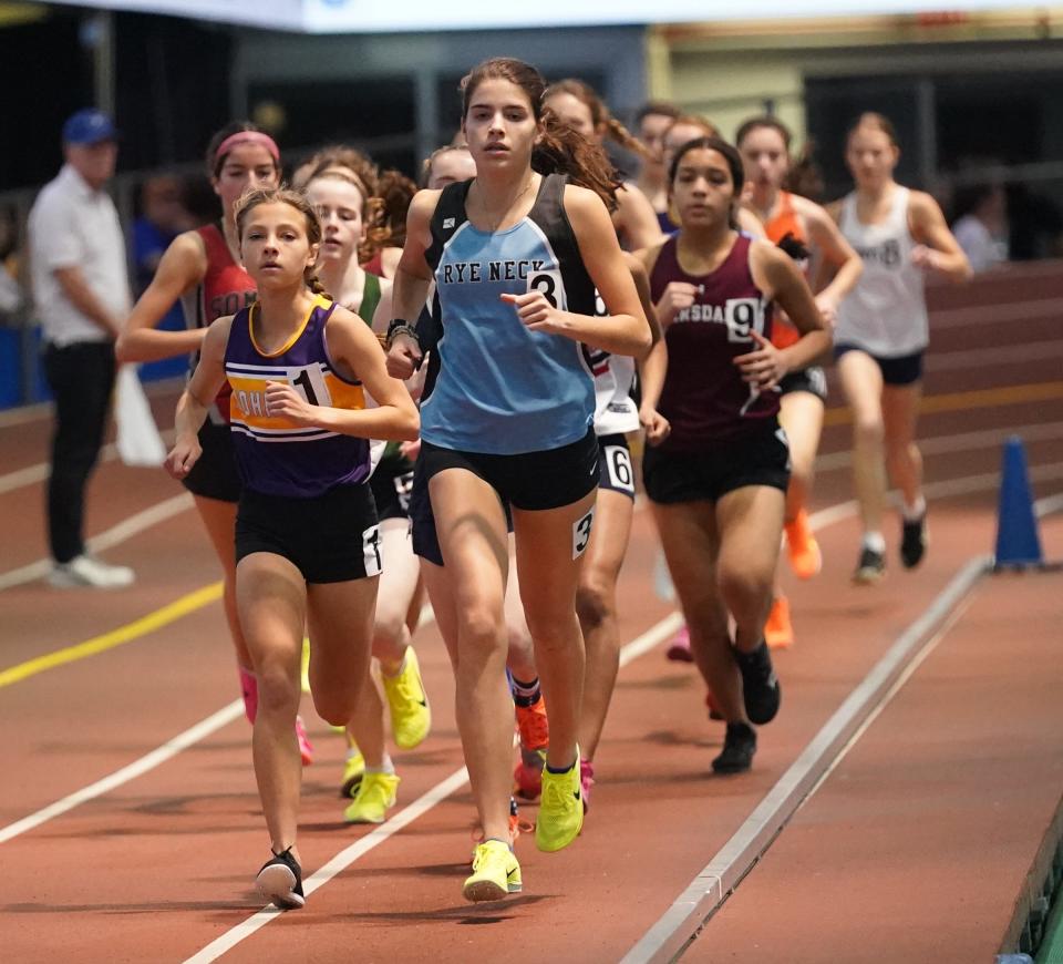 Rye Neck's Ainara Schube Barriola and John Jay-Cross River's Sloan Wasserman run the 3000-meter at the Westchester Co. Track & Field Championships at The Armory. Track & Field Center in New York on Saturday, January 28, 2023.