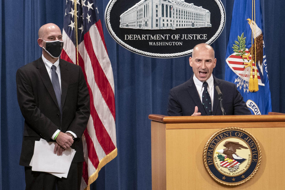 Steven D'Antuono, head of the Federal Bureau of Investigation (FBI) Washington field office, left, listens as acting U.S. Attorney Michael Sherwin, speaks during a news conference Tuesday, Jan. 12, 2021, in Washington. Federal prosecutors are looking at bringing “significant” cases involving possible sedition and conspiracy charges in last week’s riot at the U.S. Capitol. (Sarah Silbiger/Pool via AP)