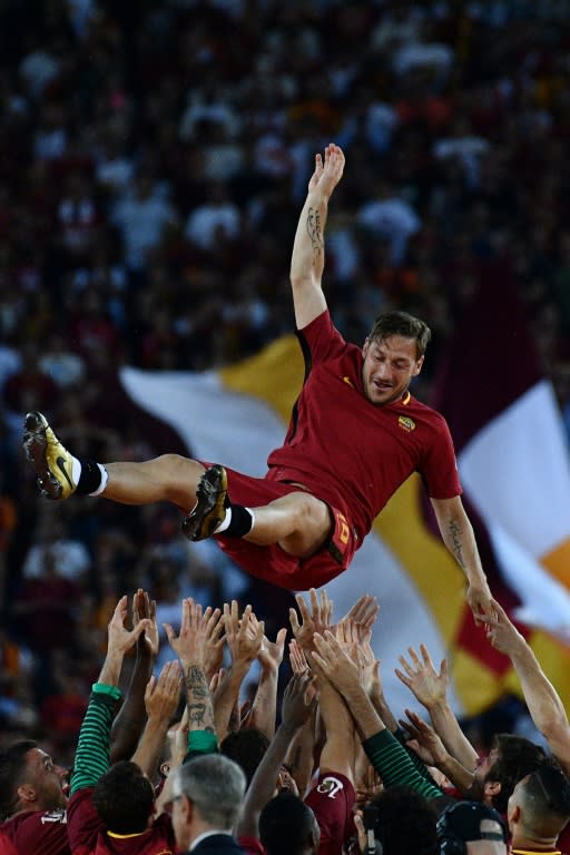 Roma's Captain Francesco Totti is tossed in the air by teammates during a ceremony following his last match on May 28, 2017