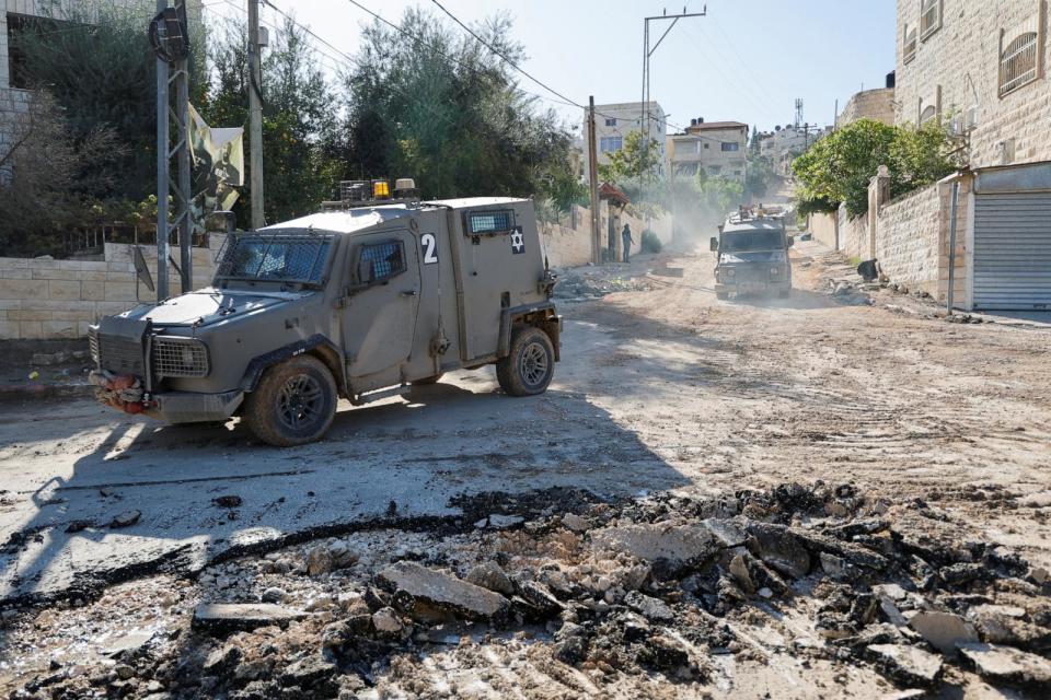 PHOTO: An Israeli military vehicle maneuvers on a road during a raid in Jenin in the Israeli-occupied West Bank, Nov. 29, 2023. (Raneen Sawafta/Reuters)