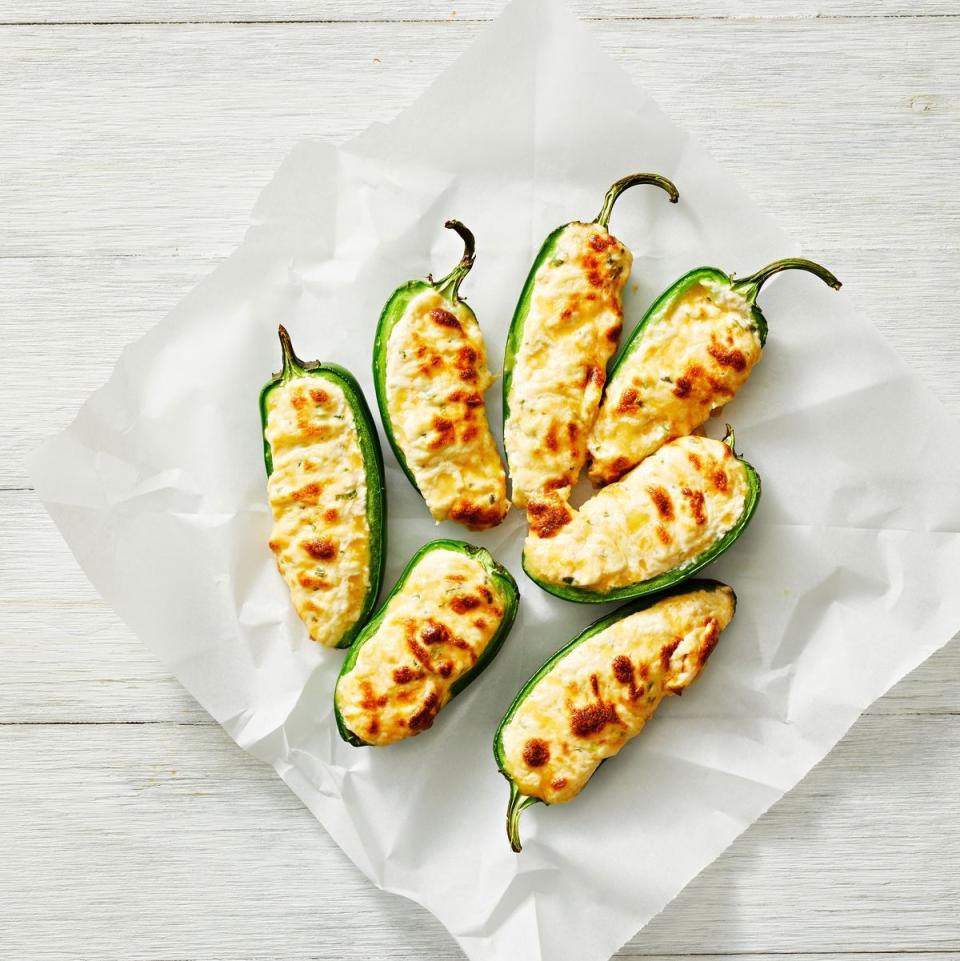 <p>Stuff jalapeños with our cream cheese, Cheddar and scallion mixture for a classic game day snack that guests will love.</p><p>Get the <strong><a href="https://www.goodhousekeeping.com/food-recipes/a42298317/air-fryer-jalapeno-poppers-recipe/" rel="nofollow noopener" target="_blank" data-ylk="slk:Air Fryer Jalapeño Poppers recipe;elm:context_link;itc:0;sec:content-canvas" class="link ">Air Fryer Jalapeño Poppers recipe</a></strong>.</p>