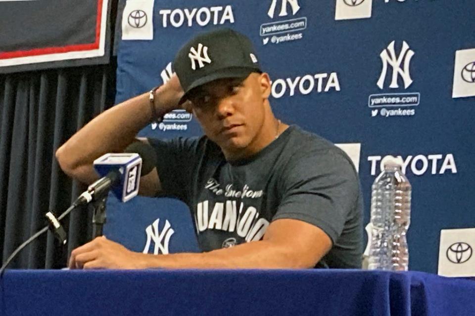 Newly acquired New York Yankees' Juan Soto attends a media availability at baseball spring training in Tampa, Fla., Monday, Feb. 19, 2024. (AP Photo/Ron Blum)