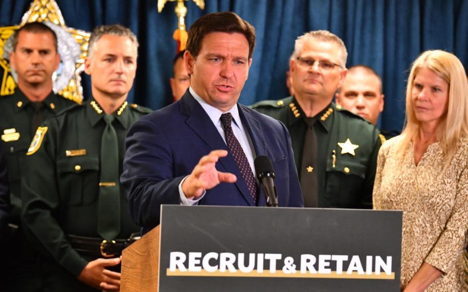 Florida Gov. Ron DeSantis discusses incentives to recruit law enforcement officers, as well as other issues, during a news conference this year in Titusville.