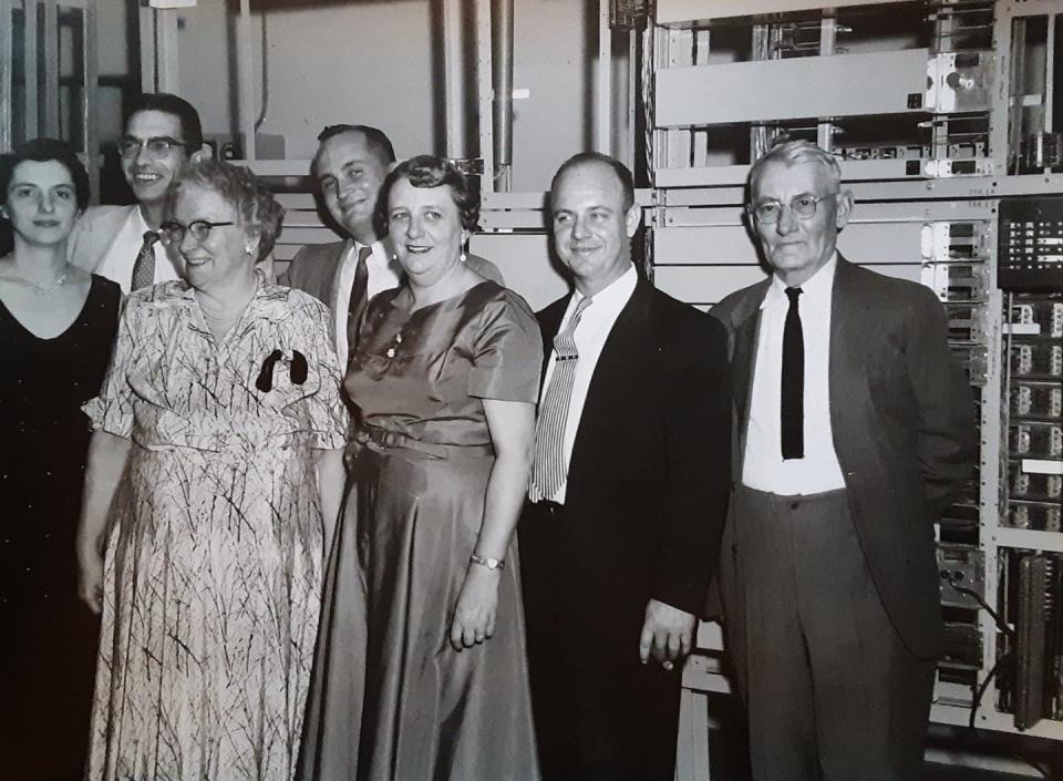 The Smith family sold their business to the Independent Telephone Company in 1961. Left to right: Betty (Chinavare) Smith, Norman Smith, Katie Smith, Charles Yoas, Margaret (Smith) Cousino, Ervin Cousino, and an unknown representative from Independent Telephone.