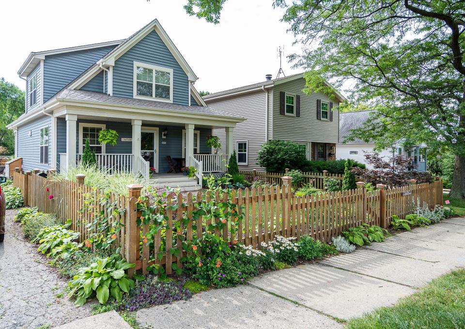 The yard of Jobey and Troy Clarke in Milwaukee is filled with plants and blooming flowers on July 12, 2023. The Clarkes expanded their gardens and added raised beds after they took down a dilapidated garaged last year.