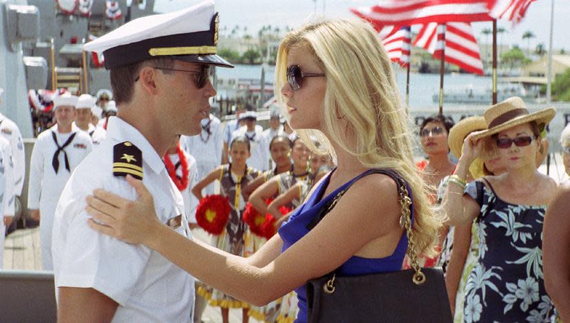In this film image released by Universal Pictures, actress Brooklyn Decker, right, is shown with Taylor Kitsch in a scene from "Battleship." A former swimsuit model, Decker is posing for the cameras more than ever. But now she's exchanged bathing suits for premiere-worthy gowns while on tour promoting her two new films, "Battleship," and "What to Expect When You're Expecting." (AP Photo/Universal Pictures) HOLD FOR SAMANTHA CRITCHELL STORY MOVING FRIDAY - In this film image released by Universal Pictures, actress Brooklyn Decker, right, is shown with Taylor Kitsch in a scene from "Battleship." A former swimsuit model, Decker is posing for the cameras more than ever. But now she's exchanged bathing suits for premiere-worthy gowns while on tour promoting her two new films, "Battleship," and "What to Expect When You're Expecting." (AP Photo/Universal Pictures)