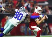 Sep 25, 2017; Glendale, AZ, USA; Arizona Cardinals quarterback Carson Palmer (3) is sacked by Dallas Cowboys defensive end DeMarcus Lawrence (90) in the second half at University of Phoenix Stadium. Mandatory Credit: Mark J. Rebilas-USA TODAY Sports