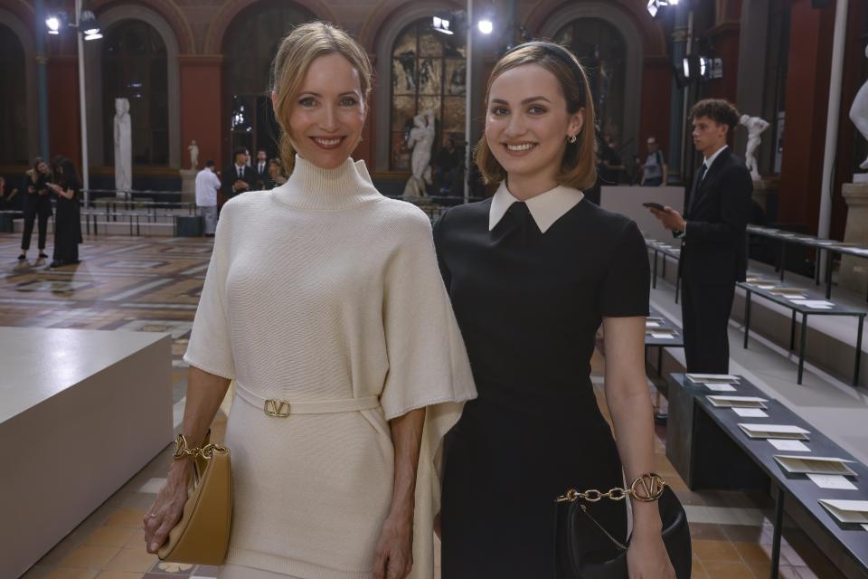 Leslie Mann, left, and Maude Apatow attend the Valentino Spring/Summer 2024 womenswear fashion collection presented Sunday, Oct. 1, 2023 in Paris. (AP Photo/Vianney Le Caer)