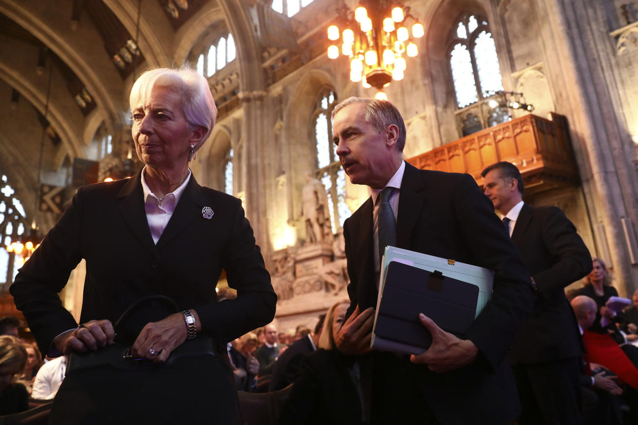 Christine Lagarde, president of the European Central Bank, left, and Mark Carney, former governor of the Bank of England, center, attend the launch of the COP26 Private Finance Agenda in London on Feb. 27, 2020