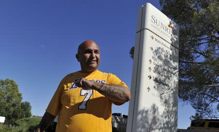 Los Angeles Lakers' fan Roy Abada of Las Vegas, lends his support at the Sunrise Hospital where ex-NBA player Lamar Odom has been hospitalized in Las Vegas, Nevada October 14, 2015. REUTERS/David Becker
