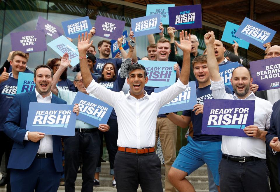 Contender to become the country's next Prime minister and leader of the Conservative party, Britain's former Chancellor to the Exchequer, Rishi Sunak (C) poses with supporters ahead of attending a hustings event, part of the Conservative party leadership campaign, in Exeter, south-west England, on August 1, 2022. - Rishi Sunak and Liz Truss are contesting a run-off to be the Conservatives' new leader, and thereby prime minister, with the ruling party's approximately 200,000 members set to vote next month. The winner to replace outgoing Prime Minister Boris Johnson will be announced on September 5, 2022. (Photo by PETER NICHOLLS / POOL / AFP) (Photo by PETER NICHOLLS/POOL/AFP via Getty Images)