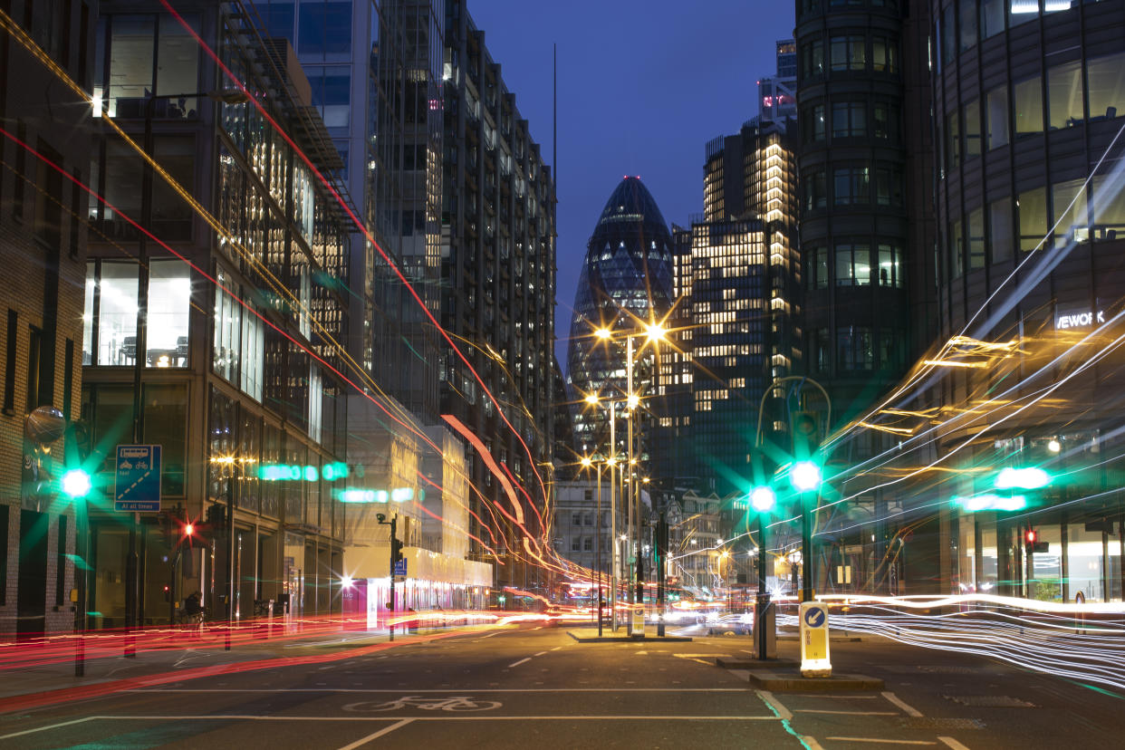 LONDON, ENGLAND - MARCH 20: Light trails left by traffic near Liverpool Street station on March 20, 2021 in London, England. A year since the British government issued its first stay-at-home order in response to the Covid-19 pandemic, on March 23, 2020, the City of London is still a ghost town of shuttered shops and restaurants, scarcely populated offices, and negligible tourist traffic. Even as the UK prepares to ease the current lockdown measures, a sense of normality in  the city's historic financial district feels a long way off. (Photo by Dan Kitwood/Getty Images)