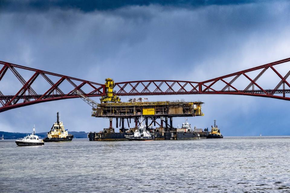 Cargo barge under bridge