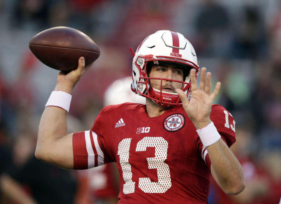 Nebraska quarterback Tanner Lee (13) warms up before an NCAA college football game against Wisconsin in Lincoln, Neb., Saturday, Oct. 7, 2017. (AP Photo/Nati Harnik)