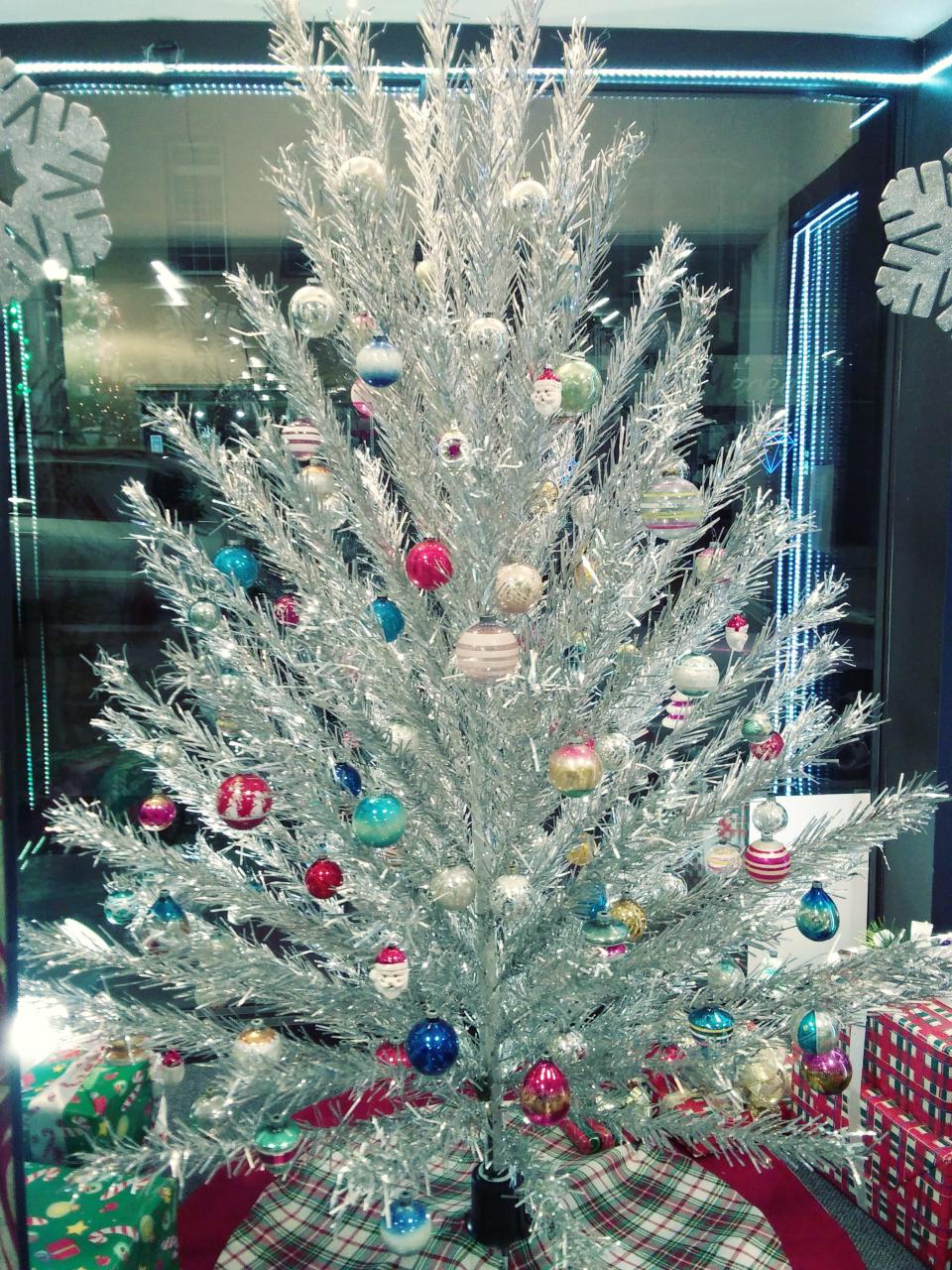 An Evergleam aluminum tree decorated as it would've been in the 1960s.