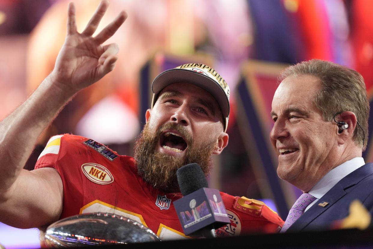 Travis Kelce, left, with Jim Nantz