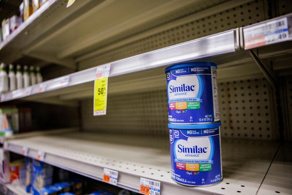 Shelves normally meant for baby formula sit nearly empty at a store in downtown Washington, DC, on May 22, 2022. - A US military plane bringing several tons of much-needed baby formula from Germany landed on May 22, 2022, at an airport in Indiana as authorities scramble to address a critical shortage.