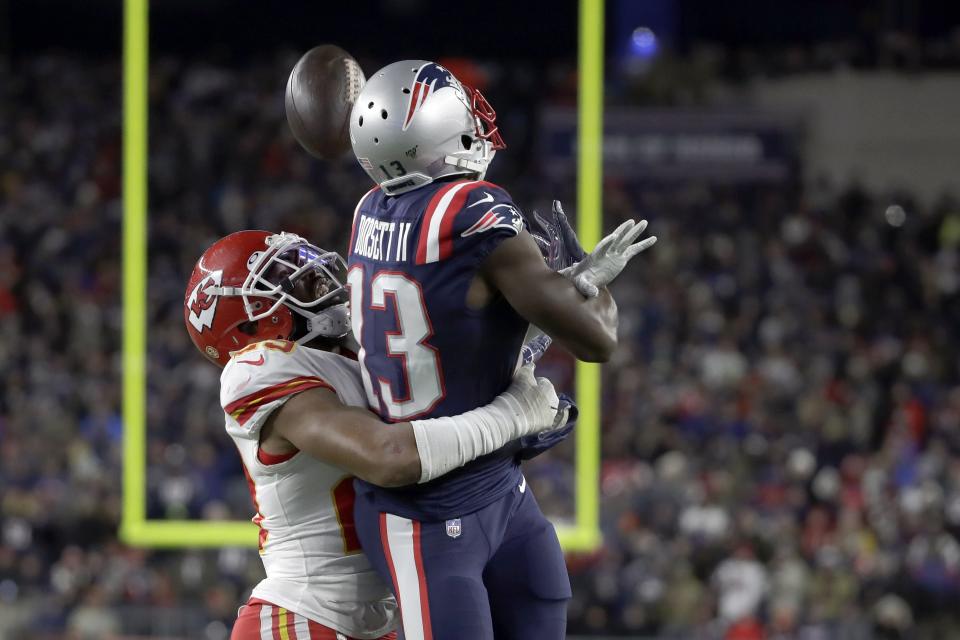 Kansas City Chiefs cornerback Kendall Fuller, left, breaks up a pass intended for New England Patriots wide receiver Phillip Dorsett in the second half of an NFL football game, Sunday, Dec. 8, 2019, in Foxborough, Mass. (AP Photo/Elise Amendola)