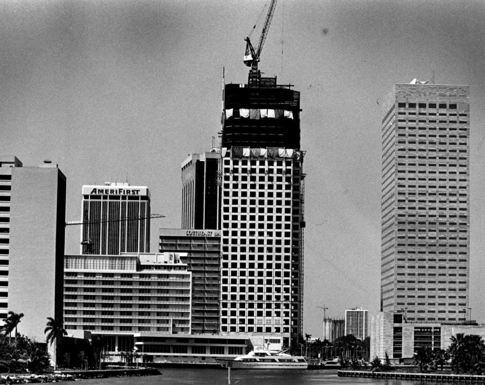 View of the downtown Miami skyline seen from Claughton Island, now known as Brickell Key, shows the construction of a new bank building, the tallest at the time in 1983.