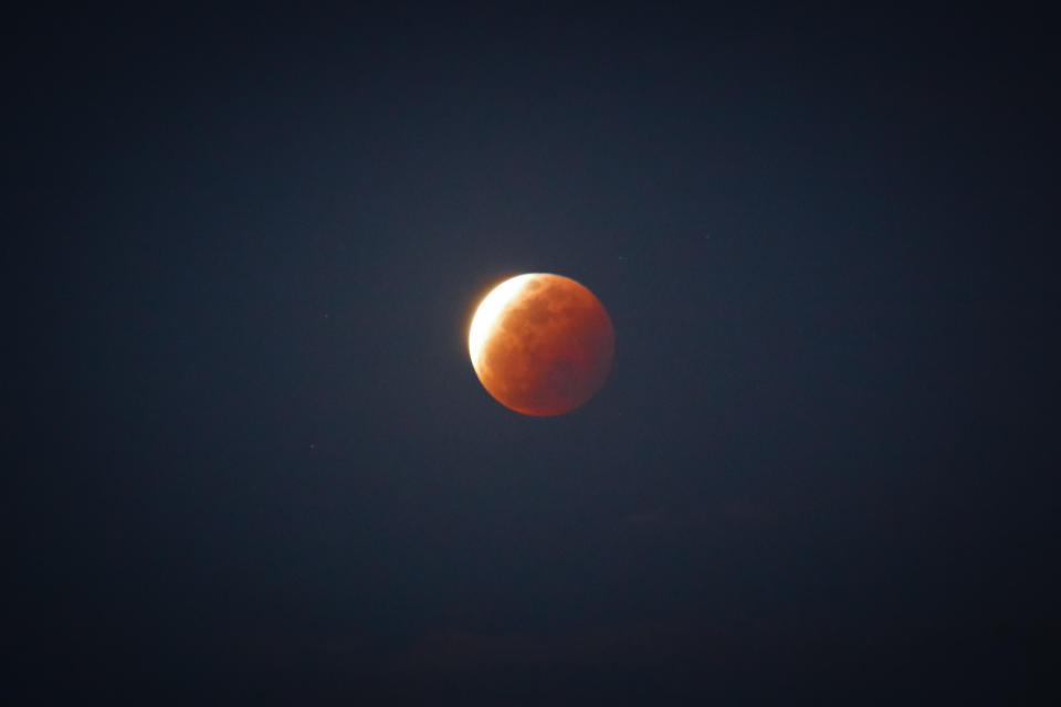 A view of Super Flower Blood Moon over Rizal Province in Philippines on May 26, 2021. The last Total Lunar Eclipse witnessed in the Philippines was 3 years ago, happened on July 28, 2018. (Photo by Ryan Eduard Benaid/NurPhoto via Getty Images)