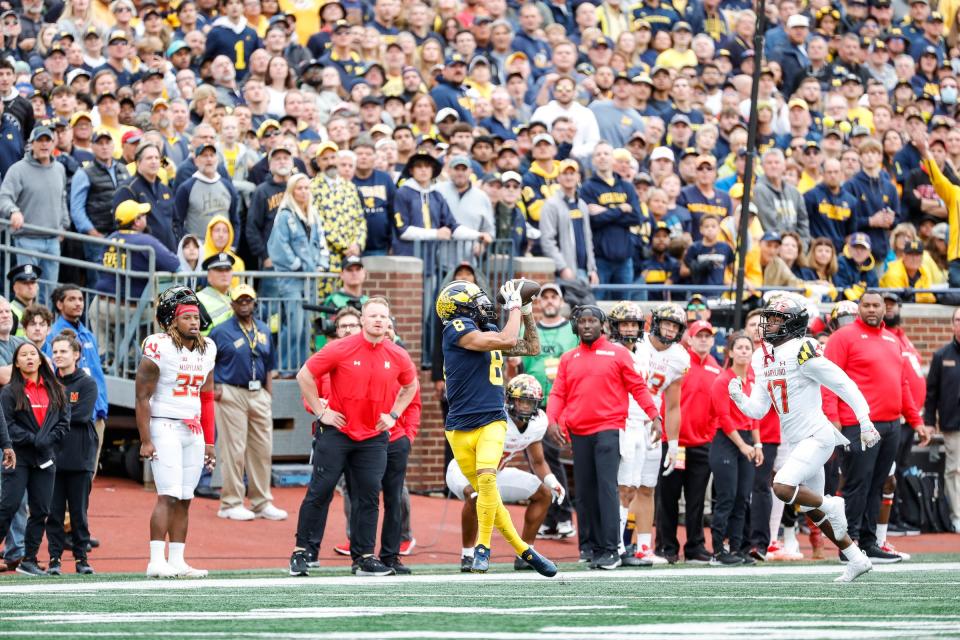 Michigan wide receiver Ronnie Bell (8) makes a catch against Maryland defensive back Lionell Whitaker (17) during the second half at the Michigan Stadium in Ann Arbor on Saturday, Sept. 24, 2022.