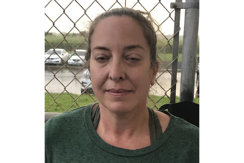 This photo provided by the Kauai Police Department shows Courtney Peterson in Lihue, Hawaii, on Nov. 29, 2020. Authorities say a couple was arrested at a Hawaii airport after traveling on a flight from the U.S. mainland despite knowing they were infected with COVID-19. The Kauai Police Department says Wesley Moribe and Courtney Peterson were arrested on suspicion of second-degree reckless endangering. (Kauai Police Department via AP)