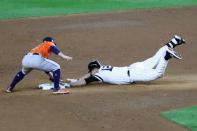 Oct 17, 2017; Bronx, NY, USA; New York Yankees third baseman Chase Headley (12) slides safely into second base against Houston Astros second baseman Jose Altuve (27) during the eighth inning in game four of the 2017 ALCS playoff baseball series at Yankee Stadium. Mandatory Credit: Anthony Gruppuso-USA TODAY Sports