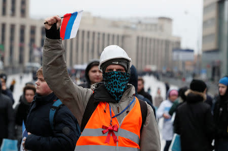 A protester attends a rally to protest against tightening state control over internet in Moscow, Russia March 10, 2019. REUTERS/Shamil Zhumatov