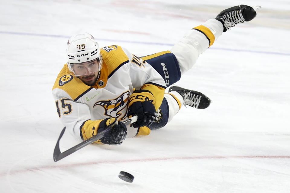 Nashville Predators defenseman Alexandre Carrier dives for the puck during the third period of an NHL hockey game against the Vegas Golden Knights, Monday, Jan. 15, 2024, in Las Vegas. (AP Photo/Ellen Schmidt)