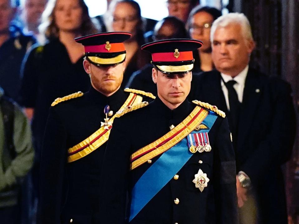 Prince William, Prince of Wales, Prince Harry, Duke of Sussex arrive to hold a vigil in honour of Queen Elizabeth II at Westminster Hall on September 17, 2022 in London.