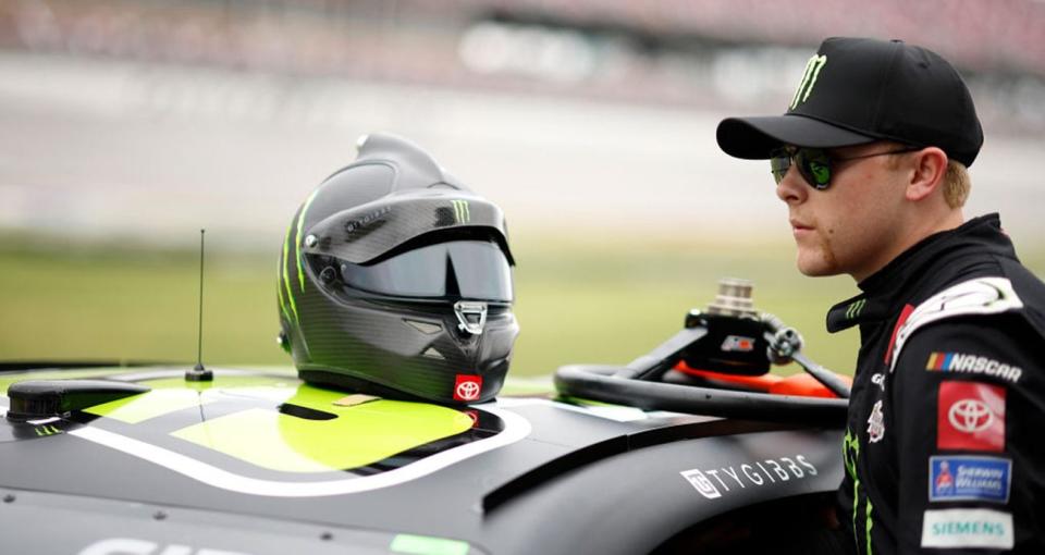 TALLADEGA, ALABAMA - APRIL 20: Ty Gibbs, driver of the #54 Monster Energy Toyota, enters his car during qualifying for the NASCAR Cup Series GEICO 500 at Talladega Superspeedway on April 20, 2024 in Talladega, Alabama. (Photo by Sean Gardner/Getty Images)