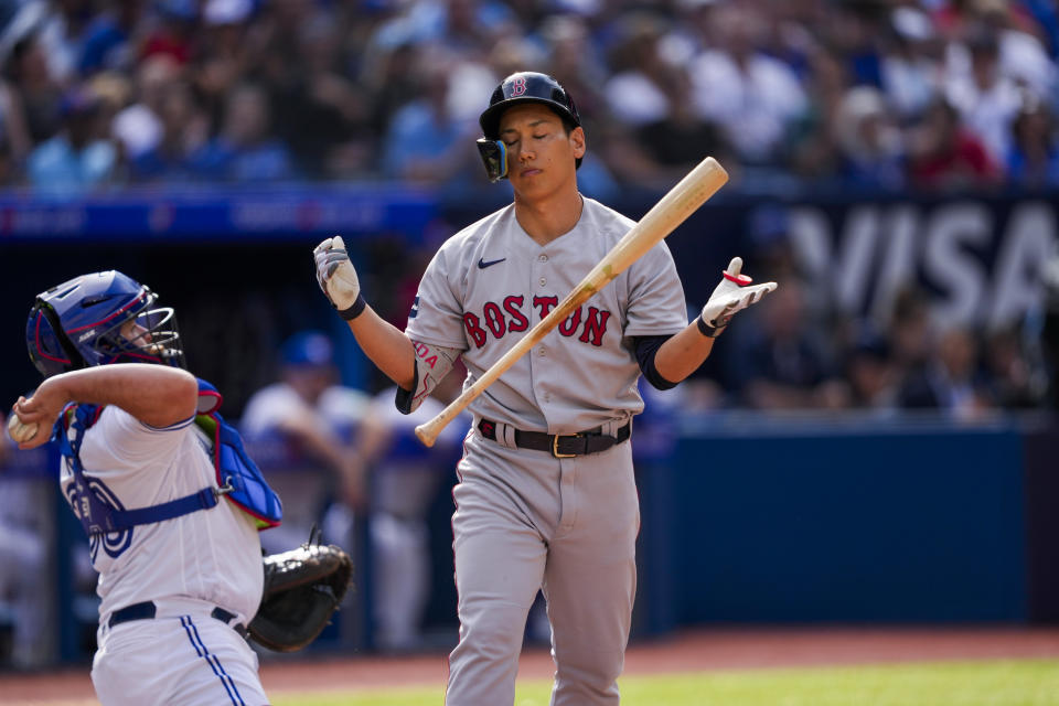 Boston Red Sox's Masataka Yoshida (7) reacts after striking out against the Toronto Blue Jays during the ninth inning of a baseball game in Toronto, Sunday, Sept. 17, 2023. (Andrew Lahodynskyj/The Canadian Press via AP)