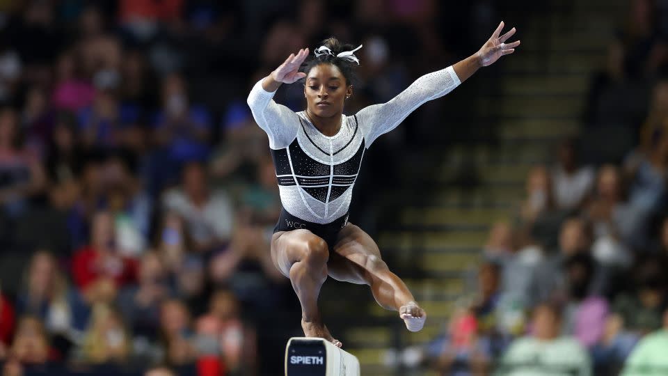 Simone Biles competes on the balance beam. - Stacy Revere/Getty Images