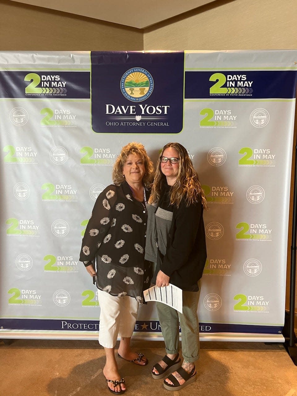 Jill Donnenworth, left, received the Robert Denton Special Achievement Award from the Ohio Attorney General's Office during the annual Two Days in May Conference.