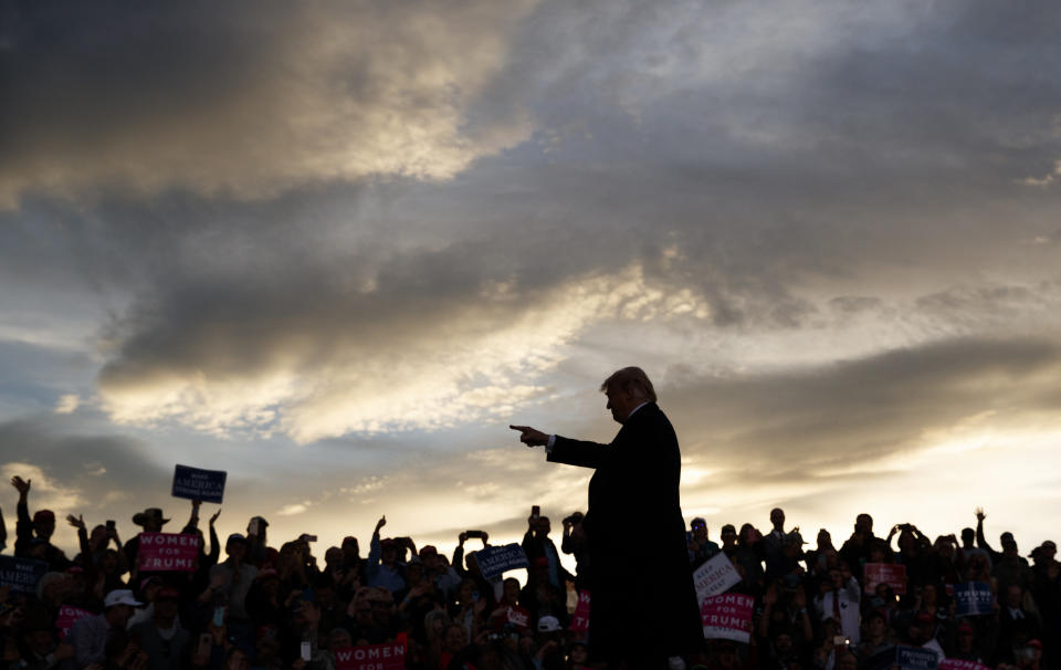 President Donald Trump arrives as the sun sets to speak at a campaign rally at Minuteman Aviation Hangar, Thursday, Oct. 18, 2018, in Missoula, Mont. (AP Photo/Carolyn Kaster)