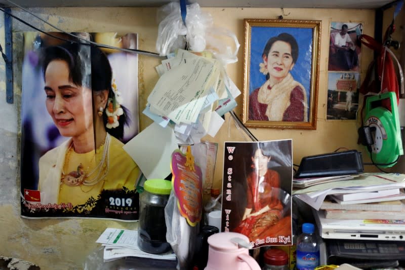 Photos of Myanmar State Counselor Aung San Suu Kyi are seen in a shop in Yangon