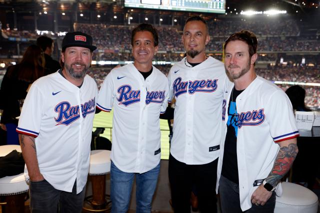 Creed band members at ALCS Game 3 in Texas Rangers gear 