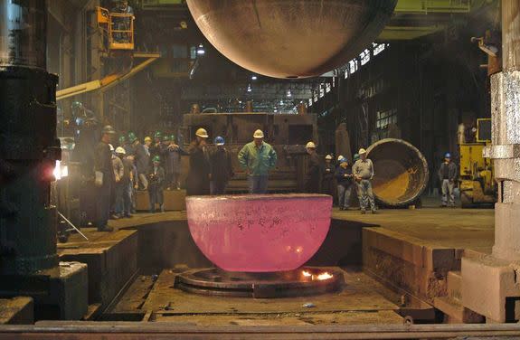 A new, slightly larger sphere was forged from titanium to replace the old personnel sphere. Above, one of two new hemispheres cools