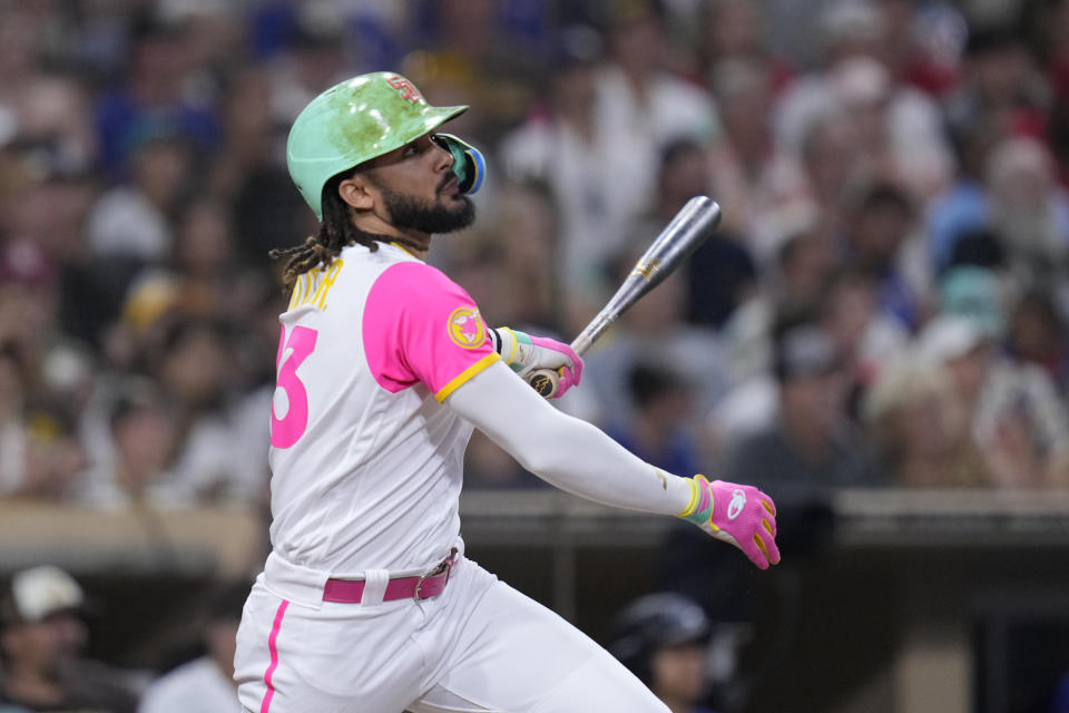 San Diego Padres' Fernando Tatis Jr. watches his home run during the fifth inning of a baseball game against the Texas Rangers, Friday, July 28, 2023, in San Diego. (AP Photo/Gregory Bull)