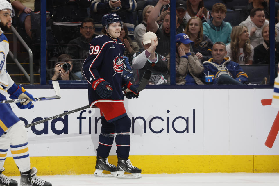 Columbus Blue Jackets' Tyler Angle celebrates his first NHL goal during the second period of a hockey game against the Buffalo Sabres Friday, April 14, 2023, in Columbus, Ohio. (AP Photo/Jay LaPrete)