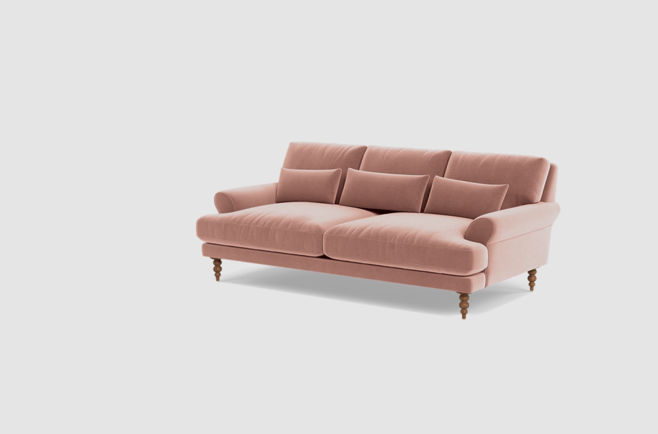 a brown couch with a tan cushion