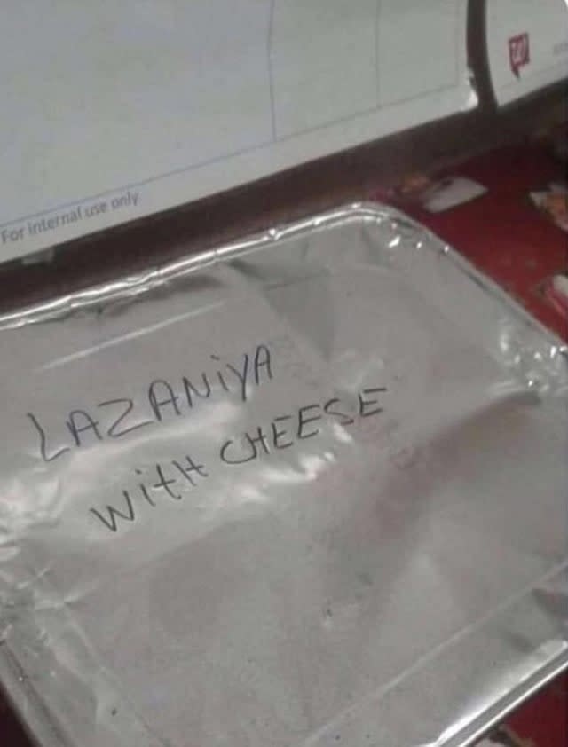 Aluminum tray labeled "lazaniya with cheese"