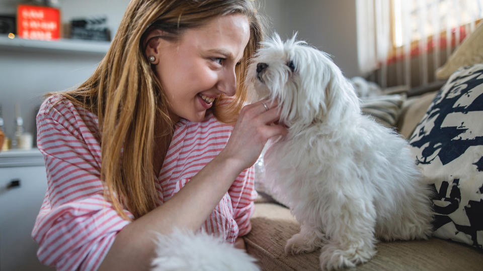 Girl cuddling rescue dog